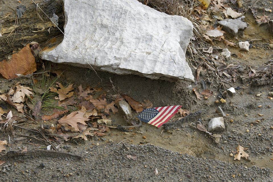 Flag And Rock On The Ground